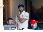 England's Mark Wood in the dressing room after leaving the field of play with an injury
