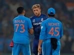 England's David Willey shakes hands with India's Mohammed Siraj and Rohit Sharma after the match